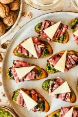 Pesto Crostini with Parmesan & Soppressata