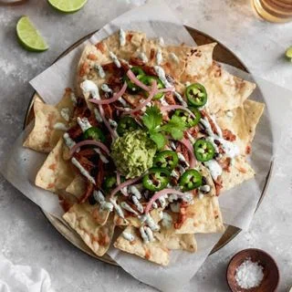 BBQ Chicken Nachos With Cilantro-Lime Crema