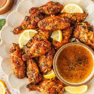 Sticky + Crispy Lemon Pepper Honey Wings