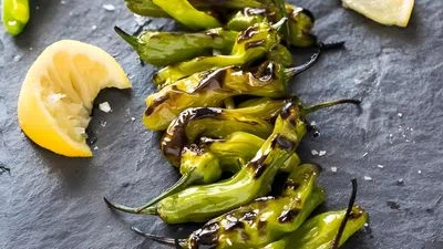 Grilled Shishito Peppers with Lemon and Sea Salt